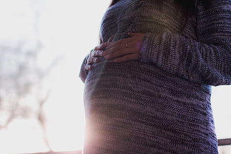 pregnant woman in gray sweater thumbnail