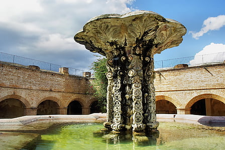 water fountain between wall under nimbus clouds thumbnail