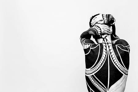 grayscale photo of person with body tattoo thumbnail
