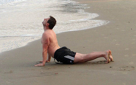 man in black shorts on seashore thumbnail