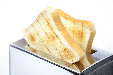 two sliced toasted bread on bread toaster thumbnail