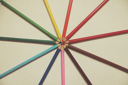 Coloured art pencils on a desk thumbnail