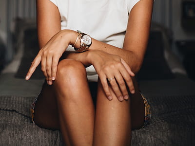 woman sitting on cushion wearing watch thumbnail