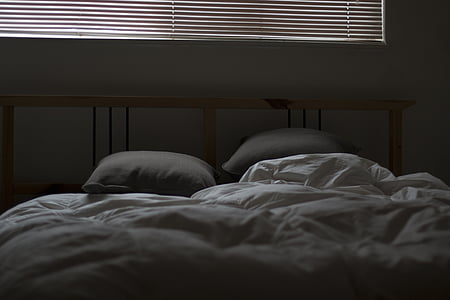 two gray pillows on bed thumbnail