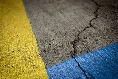 close-up photo of gray, blue, and yellow concrete pavement thumbnail