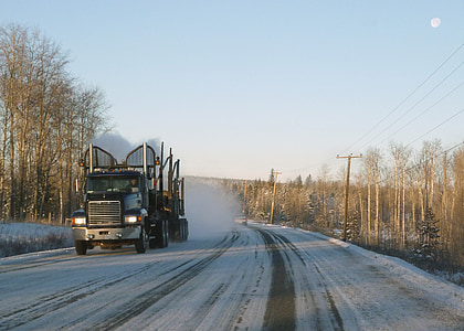 black semi-truck on snow road thumbnail