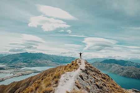 person standing near cliff thumbnail