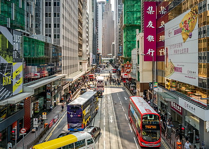 buses on street during daytime thumbnail