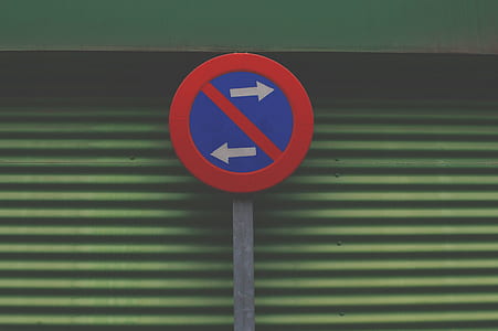 round prohibited going left or right sign on wall thumbnail
