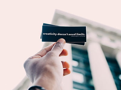 person holding printed paper thumbnail