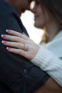 selective focus photography of woman holding man thumbnail
