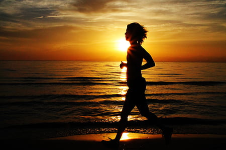 silhouette of woman near shore thumbnail