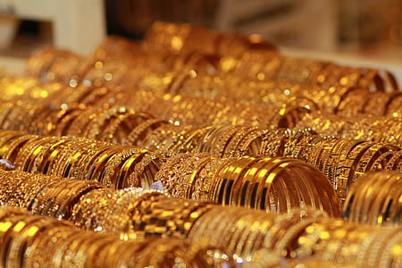 photography of gold-colored bracelet lot thumbnail
