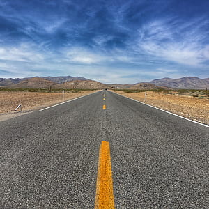 architectural photography of gray road thumbnail