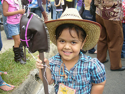 girl holding gray shovel standing near curb thumbnail