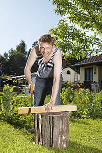 man holding wood saw thumbnail