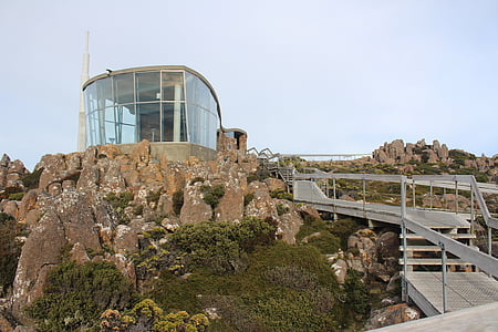 gray steel pathway surrounded by brown rocks thumbnail