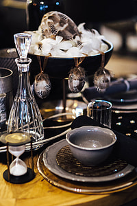 Fancy restaurant dinner table decorated with quail eggs and feathers thumbnail