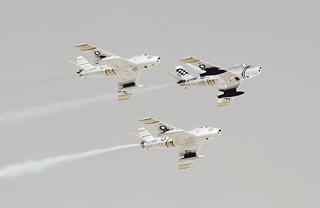 three planes flying in the sky thumbnail