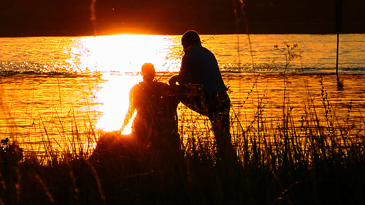 silhouette of person beside seashore thumbnail