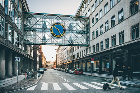 round blue clock on glass building thumbnail