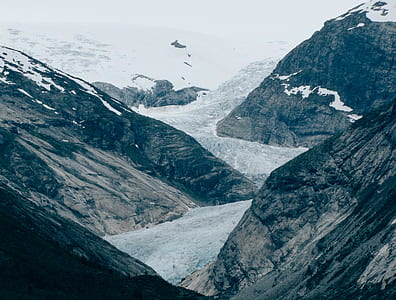 gray mountain valley during daytime thumbnail