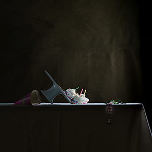 cakes with candles on table thumbnail