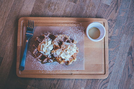 pancake on wooden tray beside cup thumbnail