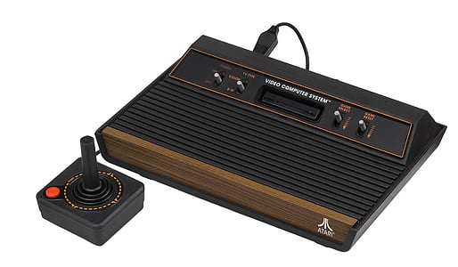 brown and black Atari with joystick thumbnail