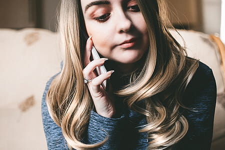 Woman in Gray Top Using Her Mobile Phone thumbnail