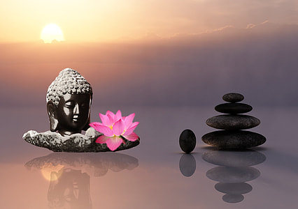 Buddha head bust and zen stones displayed thumbnail