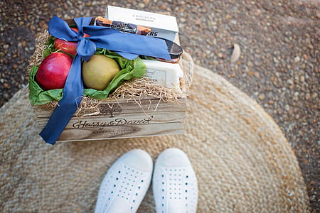Red and Green Fruits Beside White Box on Brown Wooden Box thumbnail