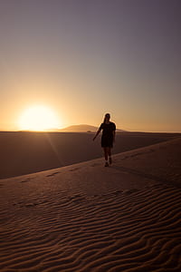 woman standing on the middle of the dessert thumbnail