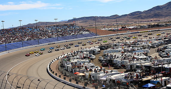 assorted-color cars racing during daytime thumbnail