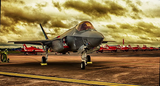 fighter jet parked on runway thumbnail