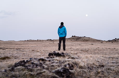man standing near mountain thumbnail