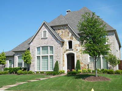 white concrete house near green leaf tree thumbnail