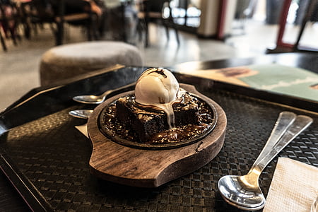 melted ice cream on top of chocolate cake thumbnail