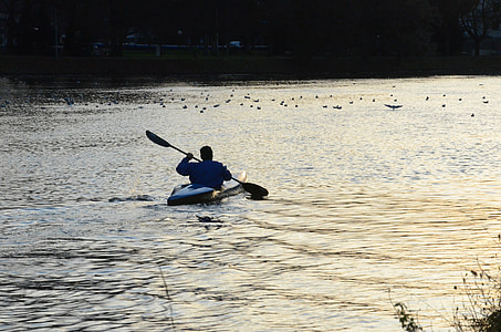 person using kayak during daytime thumbnail