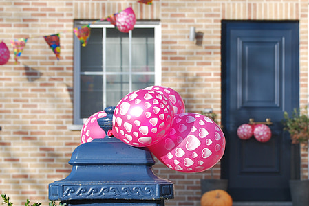 pink and white plastic balloon thumbnail
