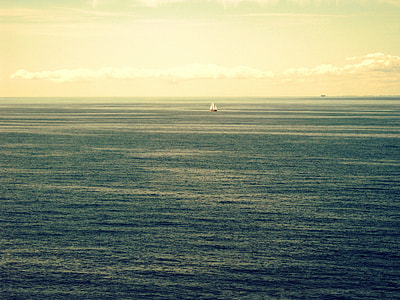 white and brown ship on body of water during daytime thumbnail