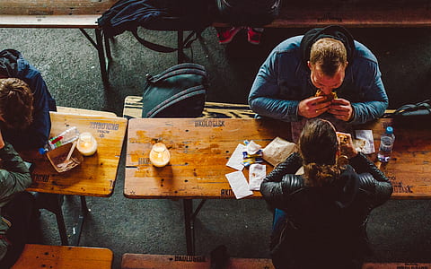man and woman eating on table thumbnail