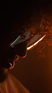 person in sunglasses looking down thumbnail