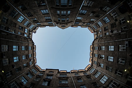 worm's eye-view photo of brown concrete buildings thumbnail