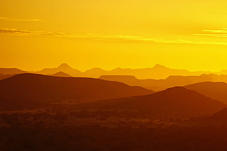 landmark photography of mountains during orange sunset thumbnail