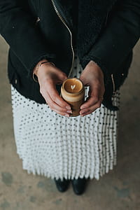 person holding coffee with heart top thumbnail