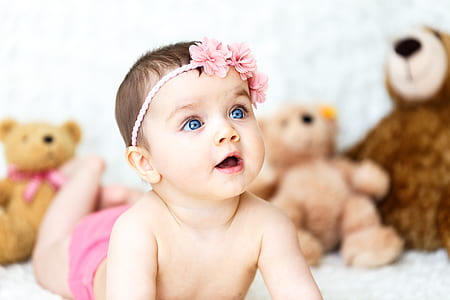 baby wearing pink floral headband thumbnail