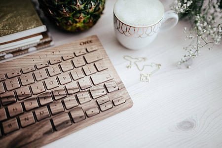 Wooden keyboard and cup of coffee thumbnail