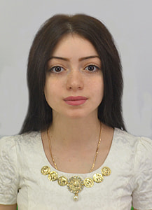 woman in white scoop neck blouse wearing gold necklace thumbnail