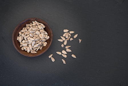 brown seeds on brown wooden plate thumbnail